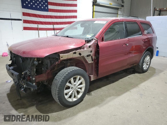 2014 Dodge Durango SXT with VIN 1C4RDJAG7EC586540, listed as a Copart auction lot 58769985 with 354,681 mi miles and Salvage title. Bid and sale history available at DreamBid. Image 1.