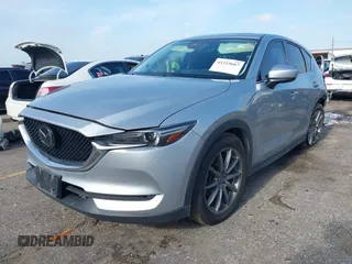 2020 Mazda CX-5 Grand Touring with VIN JM3KFADM5L0739306, listed as a IAAI auction lot 42215667 with 126,100 mi miles and . Bid and sale history available at DreamBid. Image 17.