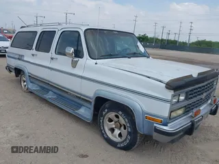 1991 Chevrolet Suburban z VIN 1GBER16K7MF150320, wystawiony jako IAAI lot #42031722 z przebiegiem 139 733 mil mil oraz . Historia ofert i sprzedaży dostępna na DreamBid. Obrazek 1.