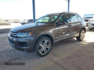 2012 Volkswagen Touareg Exec with VIN WVGEF9BP8CD008665, listed as a Copart auction lot 84611354 with 103,090 mi miles and Salvage Title. Bid and sale history available at DreamBid. Image 1.