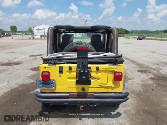 2004 Jeep Wrangler Sport z VIN 1J4FA49S04P701986, wystawiony jako IAAI lot #42256648 z przebiegiem 129 946 mil mil oraz . Historia ofert i sprzedaży dostępna na DreamBid. Obrazek 16.