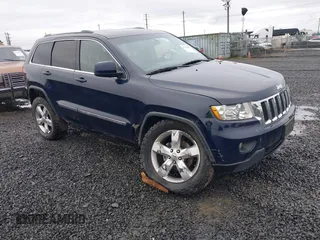 2012 Jeep Grand Cherokee Laredo with VIN 1C4RJFAG9CC220145, listed as a IAAI auction lot 41798457 with 130,603 mi miles. Bid and sale history available at carsss.com. Image 1.