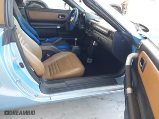2003 Toyota MR2 Spyder with VIN JTDFR320130057360, listed as a IAAI auction lot 41696384 with 52,621 mi miles. Bid and sale history available at carsss.com. Image 5.