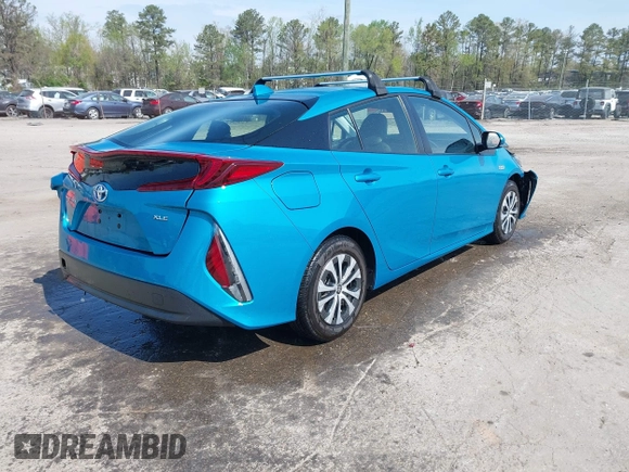 2021 Toyota Prius LE with VIN JTDKAMFP7M3180504, listed as a IAAI auction lot 41985409 with 56,617 mi miles and . Bid and sale history available at DreamBid. Image 4.