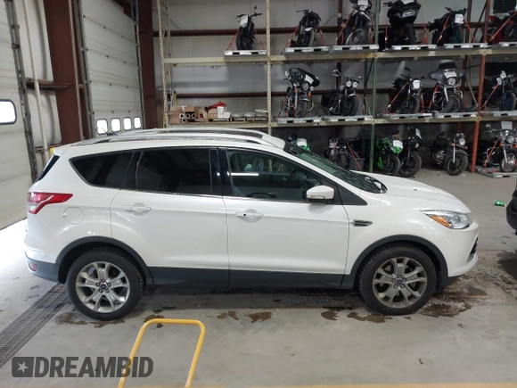 2014 Ford Escape Titanium with VIN 1FMCU9J91EUD43432, listed as a IAAI auction lot 40989177 with 110,383 mi miles and . Bid and sale history available at DreamBid. Image 13.