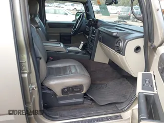 2005 Hummer H2 SUV with VIN 5GRGN23U65H101545, listed as a IAAI auction lot 41426274 with 293,821 mi miles. Bid and sale history available at carsss.com. Image 5.