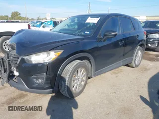 2016 Mazda CX-5 Touring with VIN JM3KE2CY6G0808992, listed as a IAAI auction lot 40969655 with 132,513 mi miles. Bid and sale history available at carsss.com. Image 2.