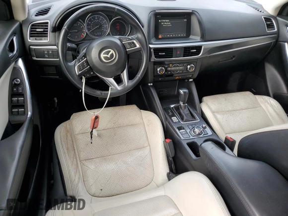 2016 Mazda CX-5 Grand Touring z VIN JM3KE2DY7G0735355, wystawiony jako Copart lot #49438285 z przebiegiem 132 731 mil mil oraz Szkoda całkowita • Salvage title. Historia ofert i sprzedaży dostępna na DreamBid. Obrazek 8.
