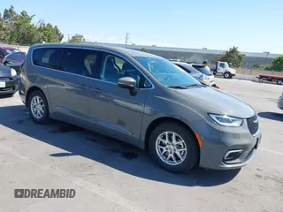 2023 Chrysler Pacifica Touring L with VIN 2C4RC1BG9PR590309, listed as a IAAI auction lot 42627642 with 65,073 mi miles and . Bid and sale history available at DreamBid. Image 1.