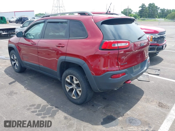 2014 Jeep Cherokee Trailhawk with VIN 1C4PJMBS7EW162357, listed as a IAAI auction lot 42601903 with 104,768 mi miles and . Bid and sale history available at DreamBid. Image 3.