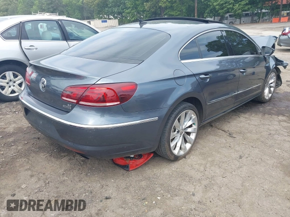 2013 Volkswagen CC Executive z VIN WVWGU7AN8DE520610, wystawiony jako IAAI lot #42278719 z przebiegiem 197 905 mil mil oraz . Historia ofert i sprzedaży dostępna na DreamBid. Obrazek 4.