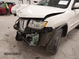 2011 Jeep Grand Cherokee 70th Anniversary with VIN 1J4RR4GG4BC702759, listed as a IAAI auction lot 41871604 with 143,583 mi miles. Bid and sale history available at carsss.com. Image 6.