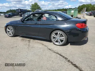 2014 BMW 4 Series 435i with VIN WBA3T3C59EP736749, listed as a Copart auction lot 76011404 with 48,815 mi miles and Salvage title. Bid and sale history available at DreamBid. Image 2.