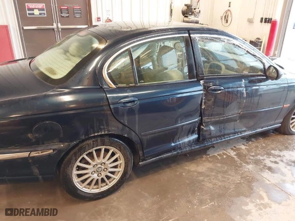 2006 Jaguar X-Type with VIN SAJWA51A56WE84382, listed as a IAAI auction lot 41594734 with NaN miles. Bid and sale history available at carsss.com. Image 6.