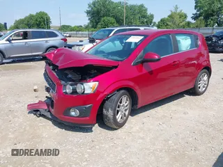 2012 Chevrolet Sonic LT with VIN 1G1JC6SH7C4135418, listed as a IAAI auction lot 42464564 with 169,035 mi miles and . Bid and sale history available at DreamBid. Image 2.