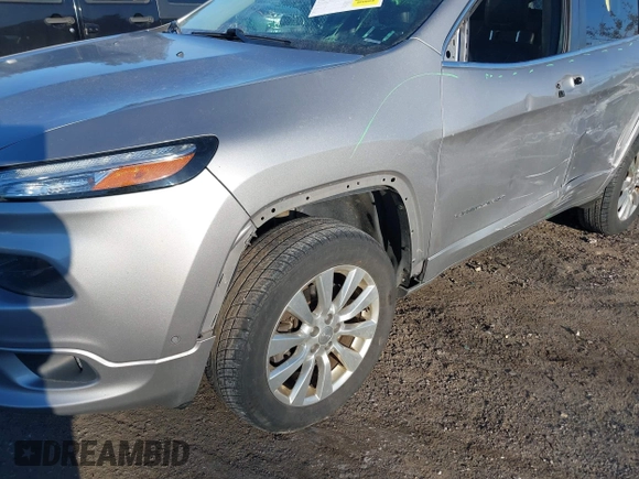 2017 Jeep Cherokee Overland z VIN 1C4PJMJS2HW599477, wystawiony jako IAAI lot #41335748 z przebiegiem 165 330 mil mil oraz . Historia ofert i sprzedaży dostępna na DreamBid. Obrazek 6.