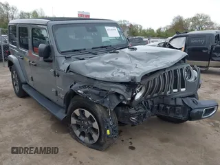 2022 Jeep Wrangler Unlimited Sahara with VIN 1C4HJXEG7NW138105, listed as a IAAI auction lot 42146898 with Not provided miles and . Bid and sale history available at DreamBid. Image 6.