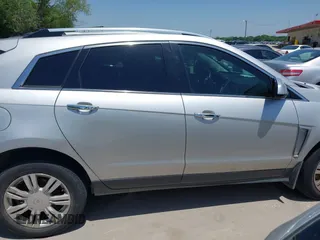 2015 Cadillac SRX Luxury Collection z VIN 3GYFNBE35FS627640, wystawiony jako IAAI lot #42262843 z przebiegiem 211 669 mil mil oraz . Historia ofert i sprzedaży dostępna na DreamBid. Obrazek 13.