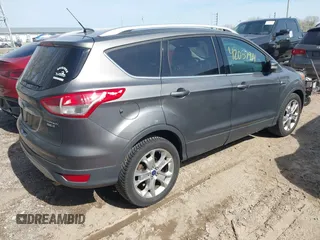 2014 Ford Escape Titanium with VIN 1FMCU9J98EUB66961, listed as a IAAI auction lot 42057914 with 101,943 mi miles. Bid and sale history available at carsss.com. Image 4.