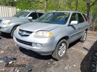 2004 Acura MDX Touring Pkg with VIN 2HNYD18664H517854, listed as a IAAI auction lot 41979134 with 144,713 mi miles. Bid and sale history available at carsss.com. Image 2.