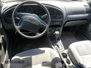 2004 Kia Spectra GS with VIN KNAFB161945141309, listed as a Copart auction lot 52395445 with 99,100 mi miles and Clean Title. Bid and sale history available at DreamBid. Image 8.