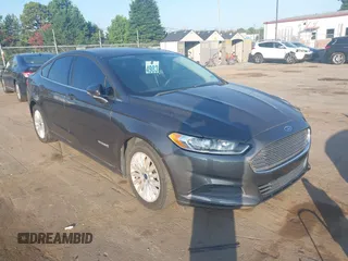 2016 Ford Fusion SE Hybrid with VIN 3FA6P0LU9GR285513, listed as a IAAI auction lot 42796945 with 150,697 mi miles and . Bid and sale history available at DreamBid. Image 1.