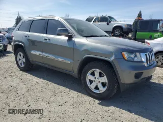 2011 Jeep Grand Cherokee Laredo with VIN 1J4RR4GGXBC702300, listed as a Copart auction lot 49736255 with 163,684 mi miles and Salvage Title. Bid and sale history available at carsss.com. Image 4.