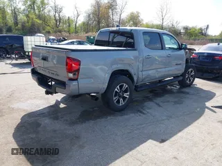 2018 Toyota Tacoma SR with VIN 3TMCZ5AN6JM170128, listed as a IAAI auction lot 42038979 with 59,497 mi miles. Bid and sale history available at carsss.com. Image 4.