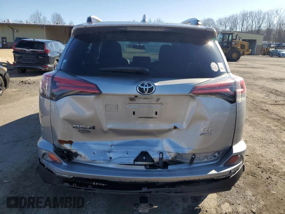 2016 Toyota RAV4 LE with VIN 2T3BFREV4GW451616, listed as a Copart auction lot 50143575 with 128,034 mi miles and Salvage Title. Bid and sale history available at DreamBid. Image 6.