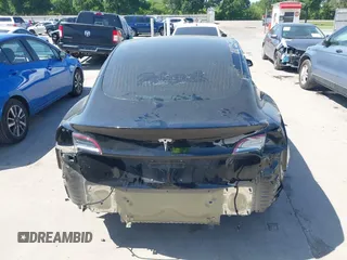 2018 Tesla Model 3 Long Range Battery with VIN 5YJ3E1EA7JF098632, listed as a IAAI auction lot 42002181 with 73,371 mi miles and . Bid and sale history available at DreamBid. Image 17.