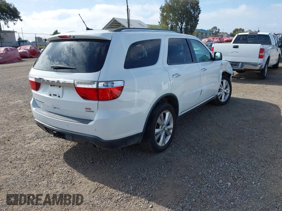 2013 Dodge Durango Crew with VIN 1C4SDHDT2DC679600, listed as a IAAI auction lot 42215737 with 128,499 mi miles and . Bid and sale history available at DreamBid. Image 4.