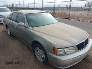 1998 Infiniti Q45 z VIN JNKBY31A6WM405273, wystawiony jako IAAI lot #41417809 z przebiegiem 117 442 mil mil oraz . Historia ofert i sprzedaży dostępna na DreamBid. Obrazek 1.