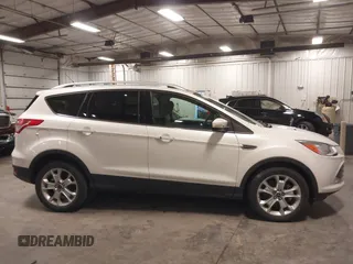 2016 Ford Escape Titanium with VIN 1FMCU9J99GUA61848, listed as a IAAI auction lot 42300324 with 51,692 mi miles and . Bid and sale history available at DreamBid. Image 13.
