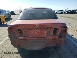 1998 Mazda Protege DX z VIN JM1BC1411W0198007, wystawiony jako Copart lot #46941185 z przebiegiem 101 696 mil mil oraz Szkoda całkowita • Salvage title. Historia ofert i sprzedaży dostępna na DreamBid. Obrazek 6.