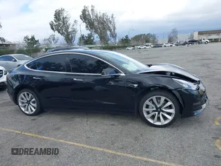 2018 Tesla Model 3 Long Range Battery with VIN 5YJ3E1EA9JF009384, listed as a IAAI auction lot 41544624 with 66,896 mi miles and . Bid and sale history available at DreamBid. Image 13.