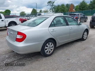 2003 Toyota Camry LE with VIN 4T1BE30K13U168509, listed as a IAAI auction lot 42220735 with 210,328 mi miles and . Bid and sale history available at DreamBid. Image 4.