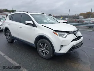 2017 Toyota RAV4 XLE with VIN JTMRFREV6HJ716907, listed as a IAAI auction lot 41056444 with 118,335 mi miles. Bid and sale history available at carsss.com. Image 1.
