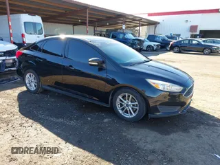 2015 Ford Focus SE with VIN 1FADP3F21FL262033, listed as a IAAI auction lot 41521714 with 101,890 mi miles. Bid and sale history available at carsss.com. Image 1.