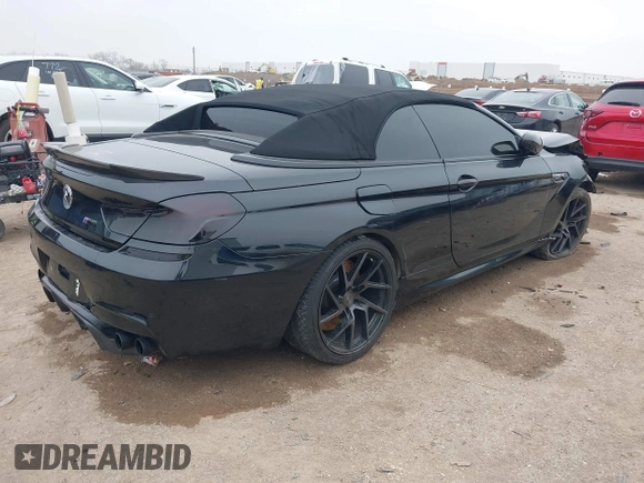 2014 BMW M6 z VIN WBSLZ9C58ED651156, wystawiony jako IAAI lot #41526192 z przebiegiem 90 642 mil mil oraz . Historia ofert i sprzedaży dostępna na DreamBid. Obrazek 4.