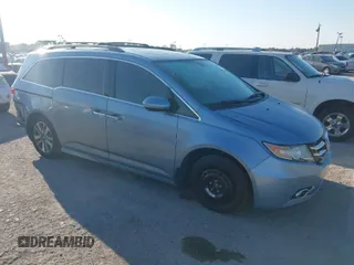 2014 Honda Odyssey Touring with VIN 5FNRL5H98EB102430, listed as a IAAI auction lot 41683822 with 185,802 mi miles and . Bid and sale history available at carsss.com. Image 1.
