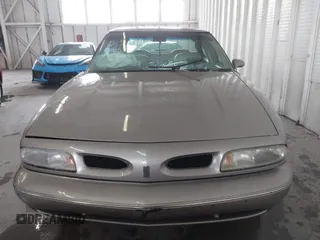 1996 Oldsmobile LSS z VIN 1G3HY5217T4809863, wystawiony jako IAAI lot #41623766 z przebiegiem 186 701 mil mil oraz . Historia ofert i sprzedaży dostępna na DreamBid. Obrazek 12.