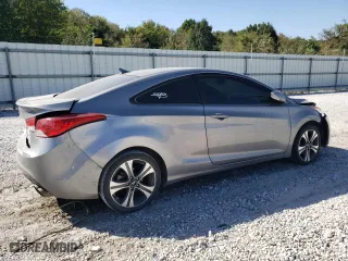 2013 Hyundai Elantra Coupe GS PZEV with VIN KMHDH6AE1DU007797, listed as a Copart auction lot 74242484 with 140,852 mi miles and Clean Title. Bid and sale history available at carsss.com. Image 3.