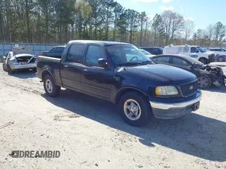 2002 Ford F-150 XLT with VIN 1FTRW07692KB42922, listed as a IAAI auction lot 41872446 with 184,756 mi miles. Bid and sale history available at carsss.com. Image 1.