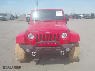 2012 Jeep Wrangler Unlimited Sahara with VIN 1C4HJWEGXCL209449, listed as a IAAI auction lot 41864432 with 100,917 mi miles. Bid and sale history available at carsss.com. Image 12.