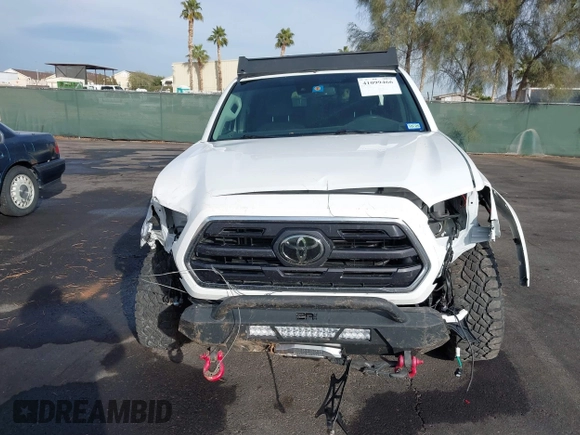 2019 Toyota Tacoma SR z VIN 3TMCZ5AN6KM284101, wystawiony jako IAAI lot #41099466 z przebiegiem 36 119 mil mil oraz . Historia ofert i sprzedaży dostępna na DreamBid. Obrazek 12.