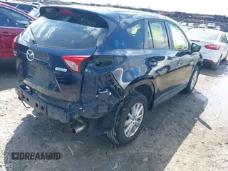 2016 Mazda CX-5 Touring with VIN JM3KE4CY0G0916908, listed as a IAAI auction lot 41848823 with 53,255 mi miles. Bid and sale history available at carsss.com. Image 4.