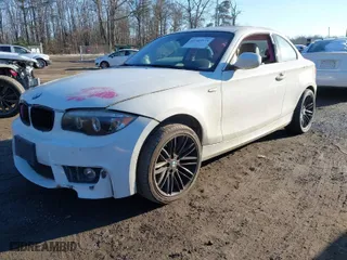 2011 BMW 1 Series 128i with VIN WBAUP7C59BVK78590, listed as a IAAI auction lot 41349575 with 119,438 mi miles. Bid and sale history available at carsss.com. Image 2.