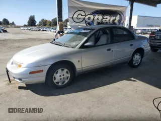 2002 Saturn SL z VIN 1G8ZH52882Z177307, wystawiony jako Copart lot #59407345 z przebiegiem 63 864 mil mil oraz Czysty tytuł • Clean title. Historia ofert i sprzedaży dostępna na DreamBid. Obrazek 1.