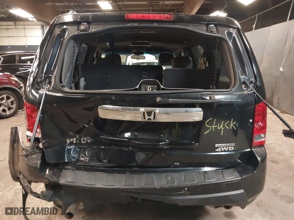 2011 Honda Pilot Touring with VIN 5FNYF4H97BB099528, listed as a IAAI auction lot 41721800 with 132,979 mi miles. Bid and sale history available at carsss.com. Image 16.