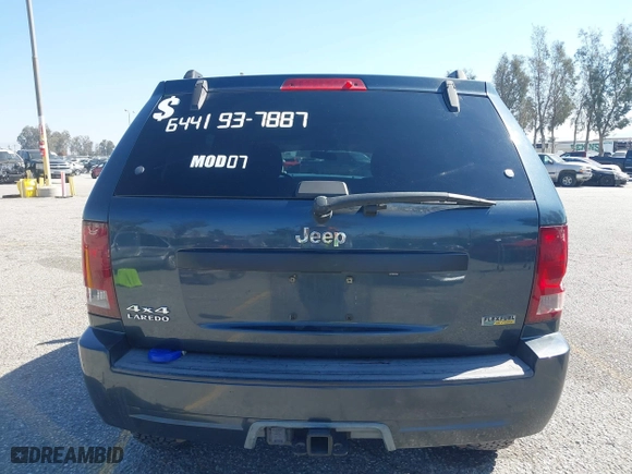2007 Jeep Grand Cherokee Laredo with VIN 1J8HR48PX7C660601, listed as a IAAI auction lot 41652509 with 131,556 mi miles. Bid and sale history available at carsss.com. Image 17.